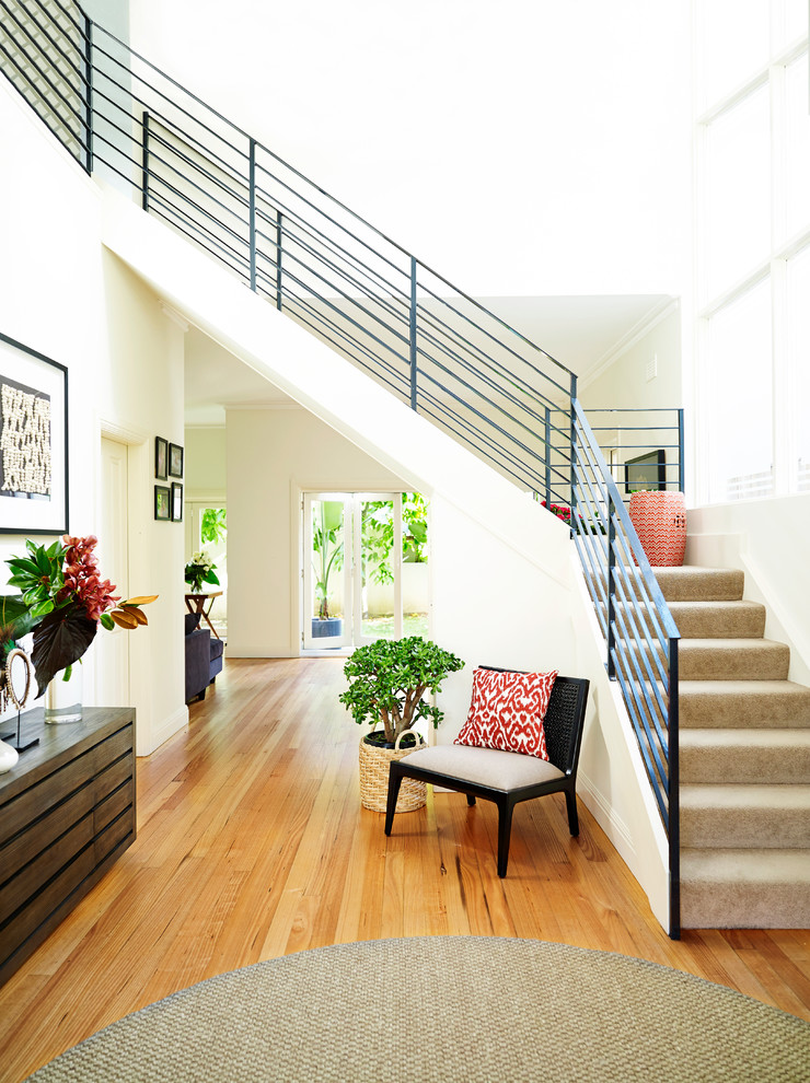 Example of a small trendy l-shaped staircase design in Sydney