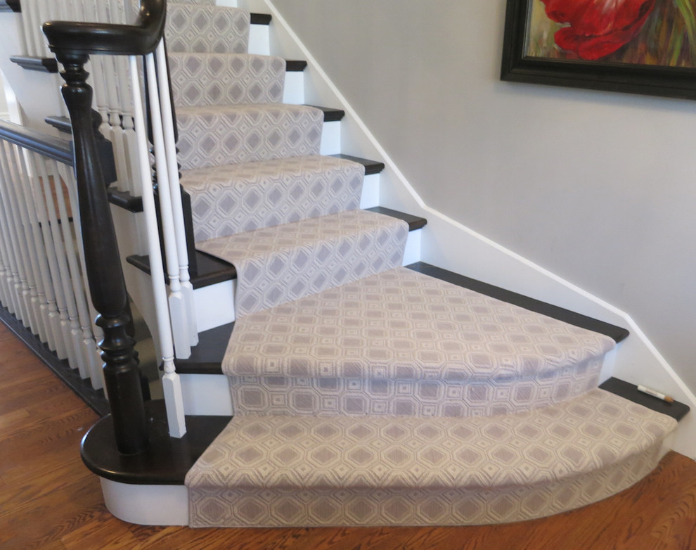 Transitional painted straight staircase photo in New York with painted risers