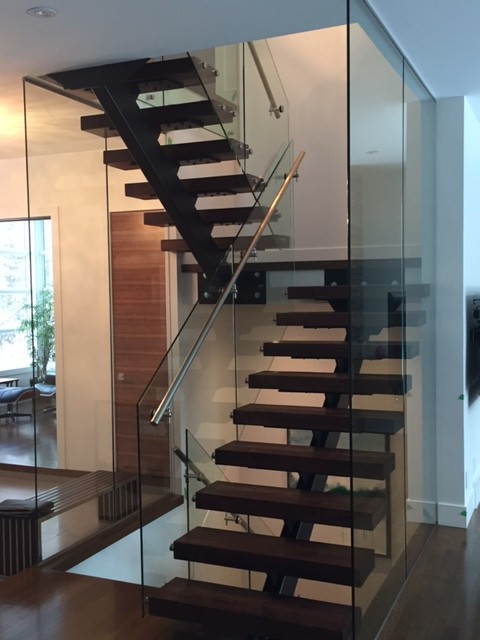 Staircase - mid-sized contemporary staircase idea in Calgary
