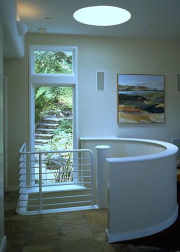 This is an example of a medium sized contemporary carpeted spiral metal railing staircase in San Francisco with open risers.