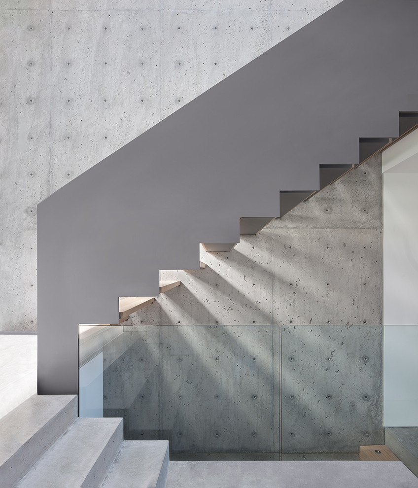 Minimalist wooden u-shaped open staircase photo in Vancouver