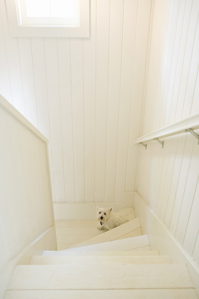Staircase - transitional painted staircase idea in Los Angeles with painted risers