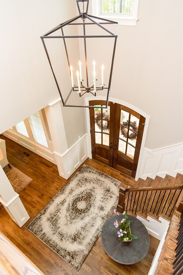 Staircase - large transitional wooden l-shaped staircase idea in Raleigh with wooden risers