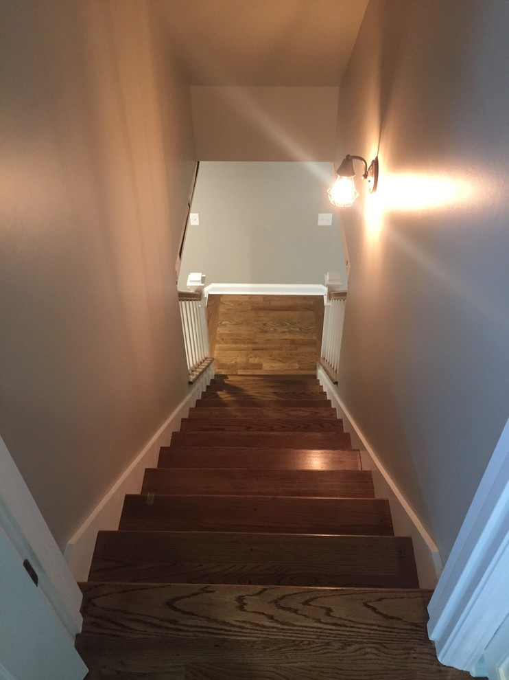 Staircase - mid-sized traditional wooden straight wood railing staircase idea in Charlotte with wooden risers