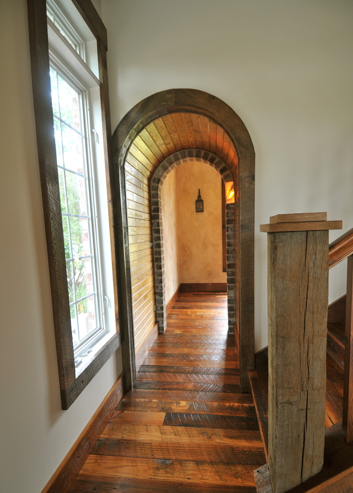 Inspiration for a rustic wooden straight staircase remodel in Charleston with wooden risers
