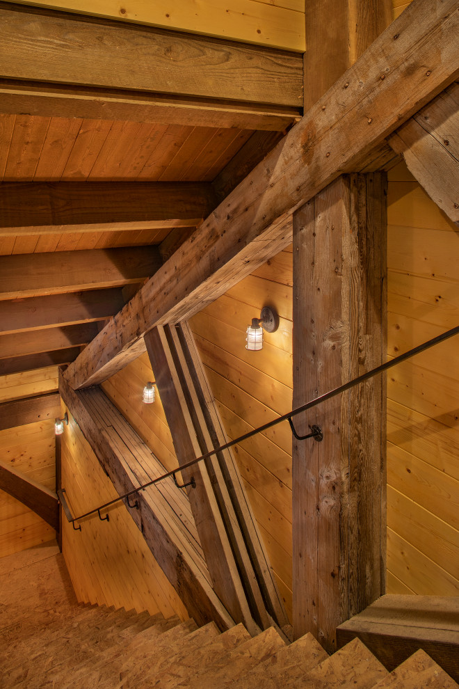 Mittelgroße Urige Holztreppe in U-Form mit Holz-Setzstufen und Stahlgeländer in Seattle
