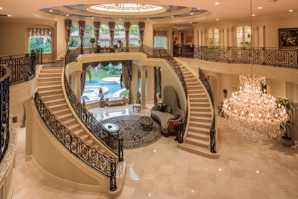 Huge tuscan curved metal railing staircase photo in Houston