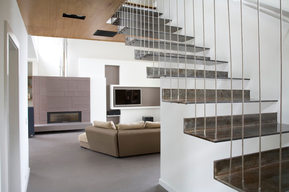 Design ideas for a contemporary metal floating staircase in New York with open risers.