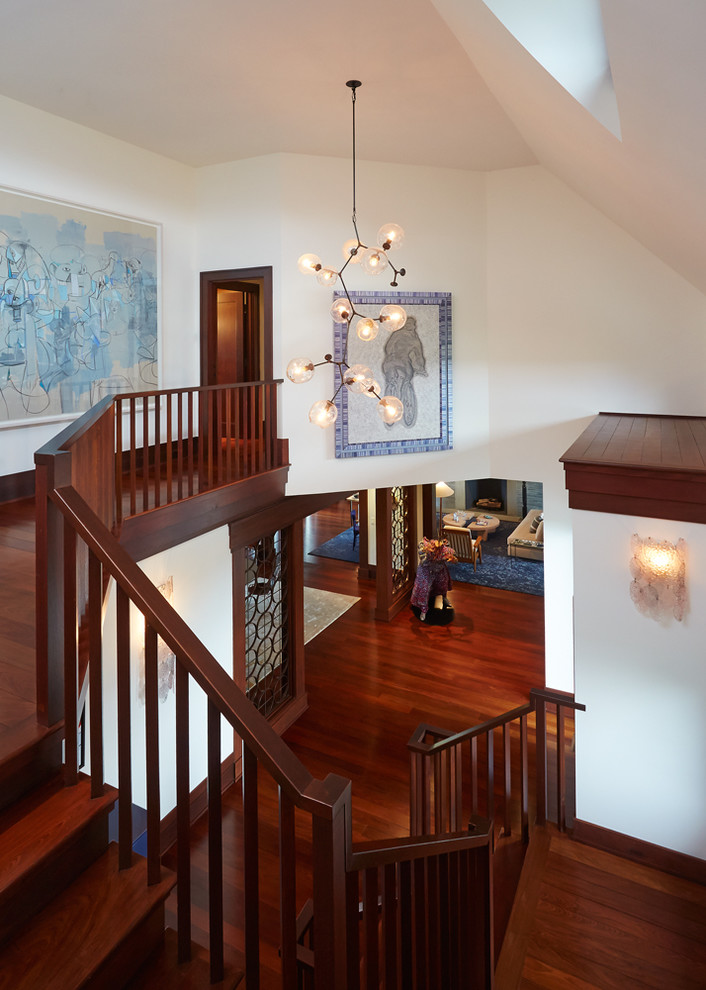 Large midcentury wood u-shaped staircase in New York with wood risers.