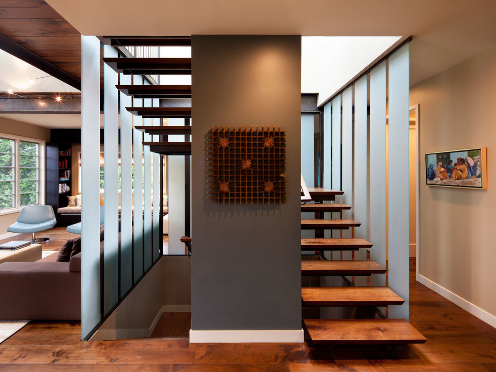Inspiration for a contemporary wood floating staircase in San Francisco with open risers.