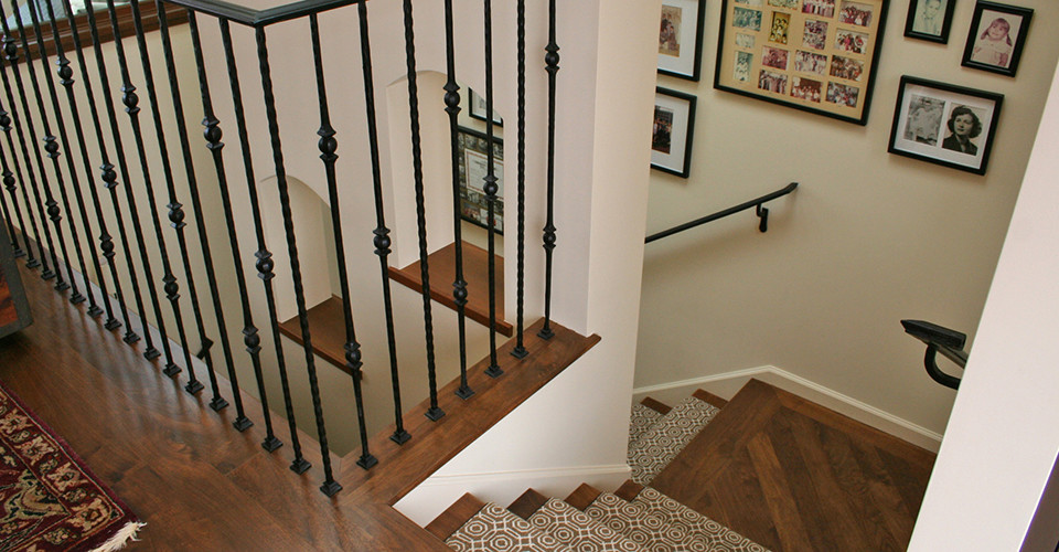Large mediterranean carpeted l-shaped staircase in San Francisco with wood risers.