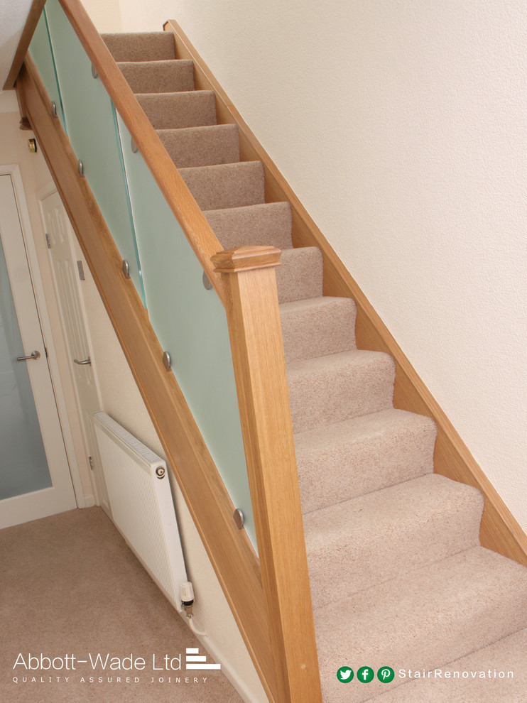 Photo of a carpeted straight staircase in Cheshire with carpeted risers.