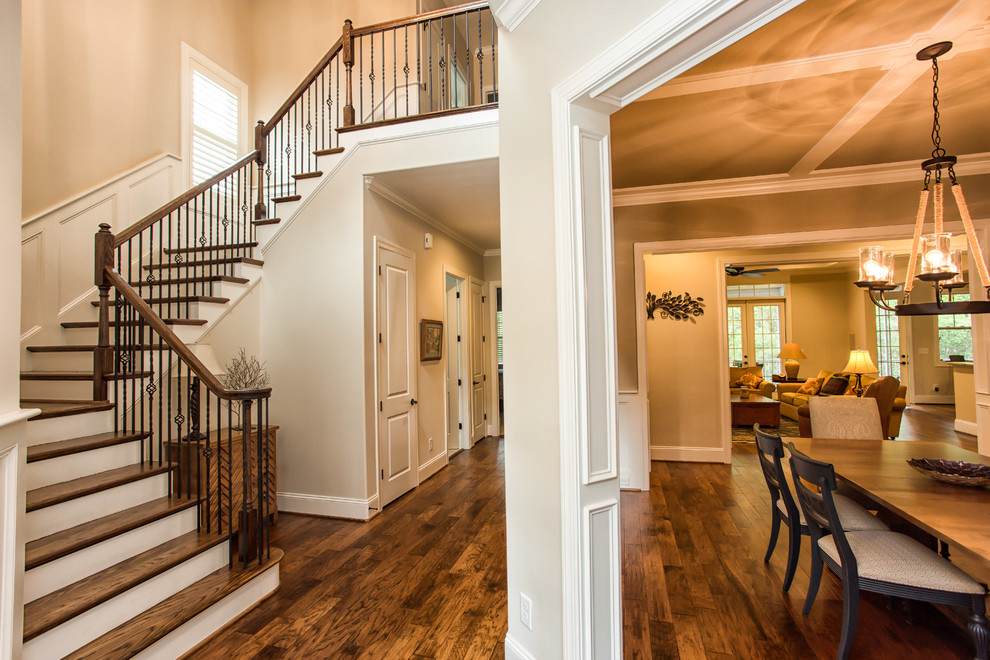 Staircase - mid-sized traditional wooden u-shaped staircase idea in Other with painted risers