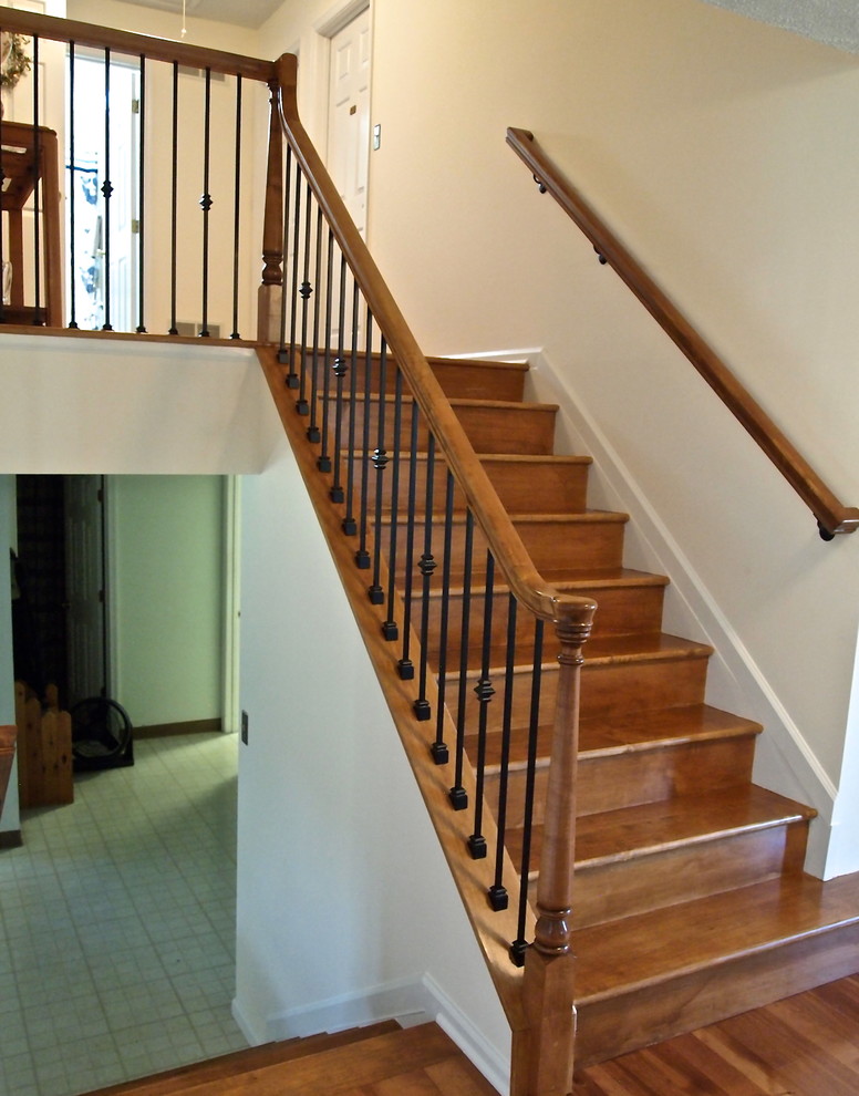 Photo of a medium sized traditional wood u-shaped staircase in Baltimore with wood risers.