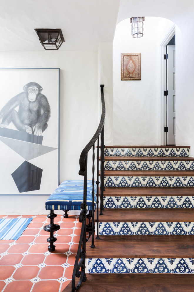 Inspiration for a medium sized mediterranean wood straight metal railing staircase in Los Angeles with tiled risers.