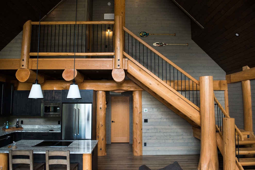 Design ideas for a medium sized rustic wood l-shaped wood railing staircase in Vancouver with open risers.