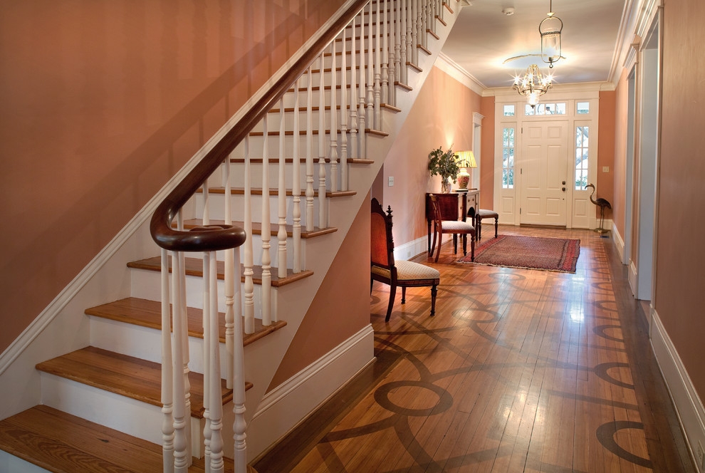 Example of a mid-sized classic wooden straight staircase design in Atlanta with wooden risers