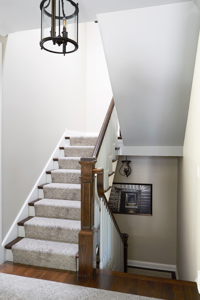 Large cottage carpeted wood railing staircase photo in Chicago