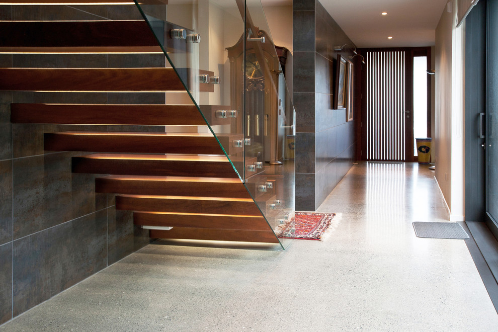This is an example of a large wood floating staircase in Wellington with open risers.
