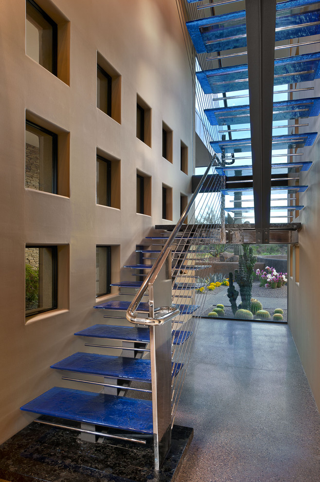 Example of a huge southwest glass u-shaped open and cable railing staircase design in Phoenix