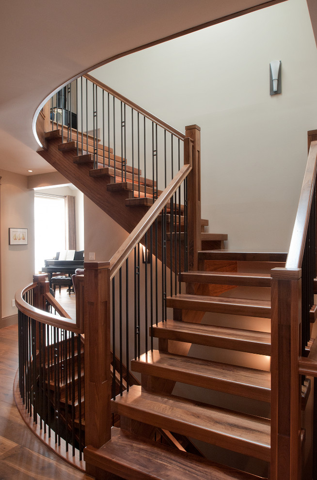 Imagen de escalera en L de estilo americano grande sin contrahuella con escalones de madera y barandilla de varios materiales