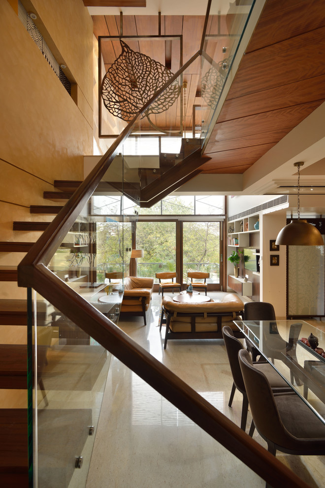 This is an example of a contemporary floating staircase in Delhi with feature lighting.