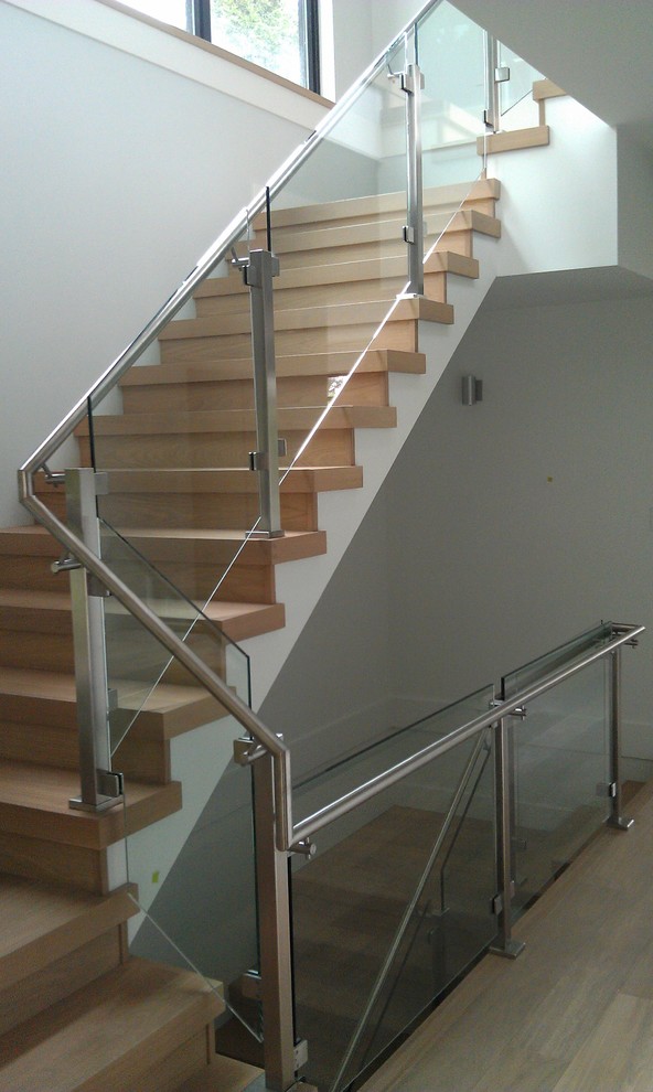 Staircase - large modern wooden l-shaped staircase idea in Vancouver with wooden risers