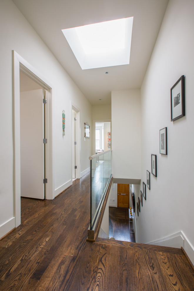 This is an example of a small contemporary wood straight staircase in DC Metro with wood risers.