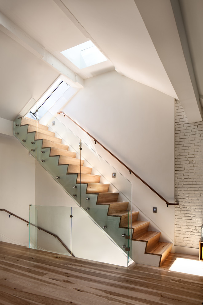 Contemporary wood straight staircase in Boston with wood risers.