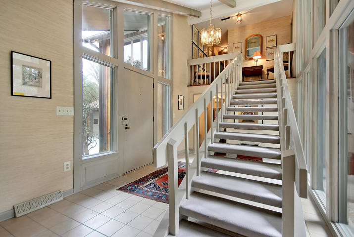 Inspiration for a mid-sized timeless carpeted straight open staircase remodel in Charleston