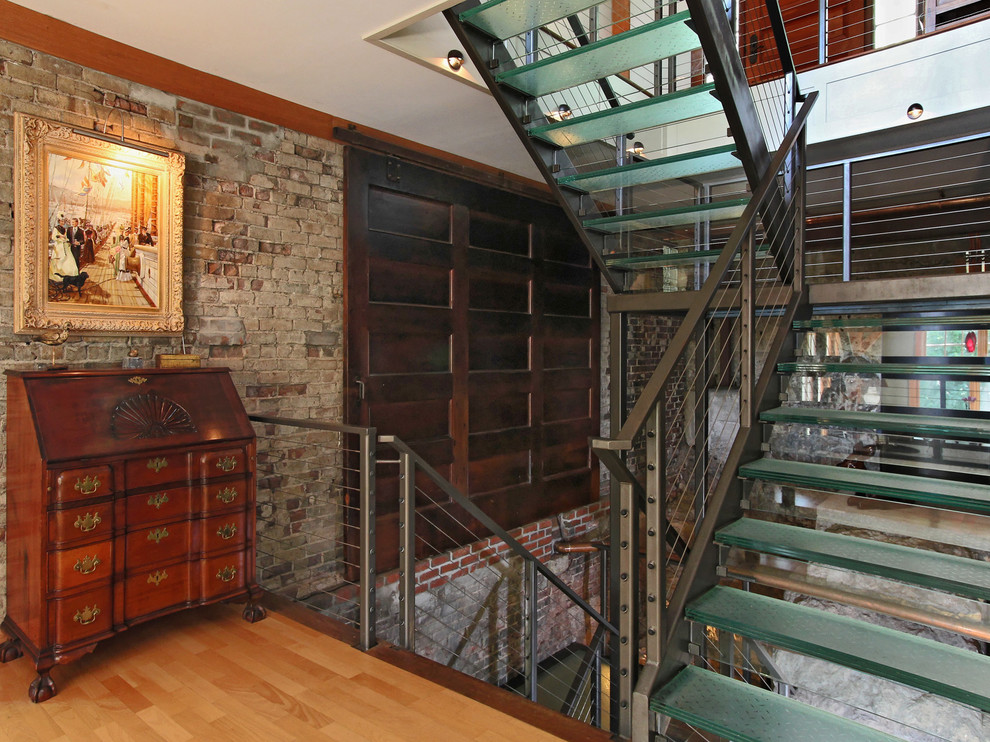 Example of a large urban glass u-shaped open staircase design in Portland Maine