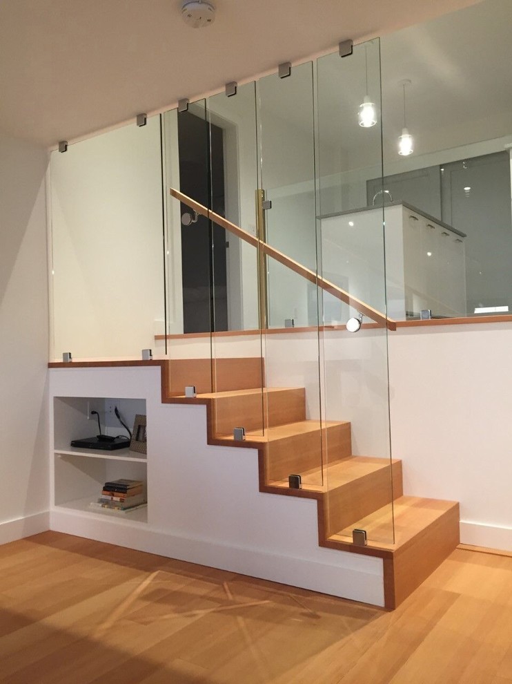Design ideas for a small contemporary wood straight wood railing staircase in Vancouver with wood risers.