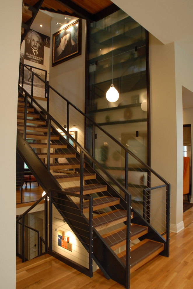This is an example of a contemporary staircase in Minneapolis with open risers.