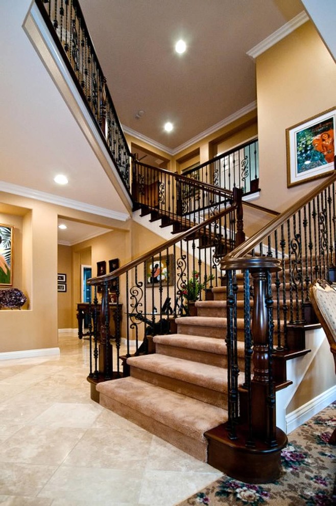 Medium sized classic carpeted l-shaped staircase in Los Angeles with carpeted risers.