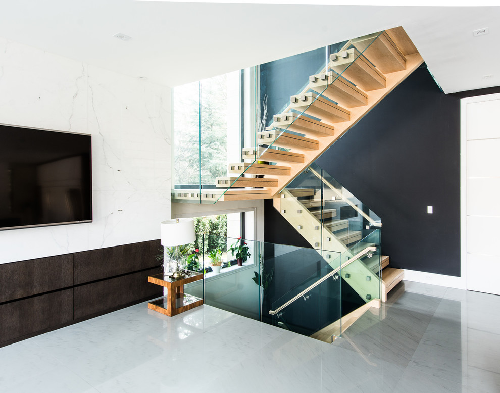 Large trendy wooden floating open staircase photo in Toronto