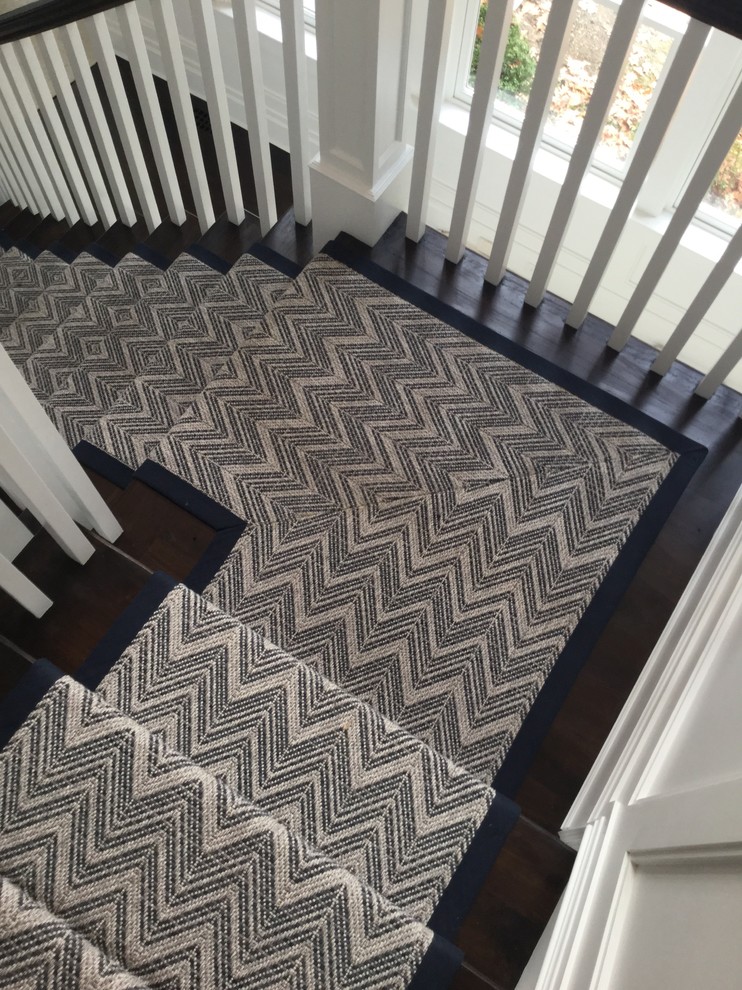 Inspiration for a medium sized nautical carpeted curved staircase in New York with carpeted risers.
