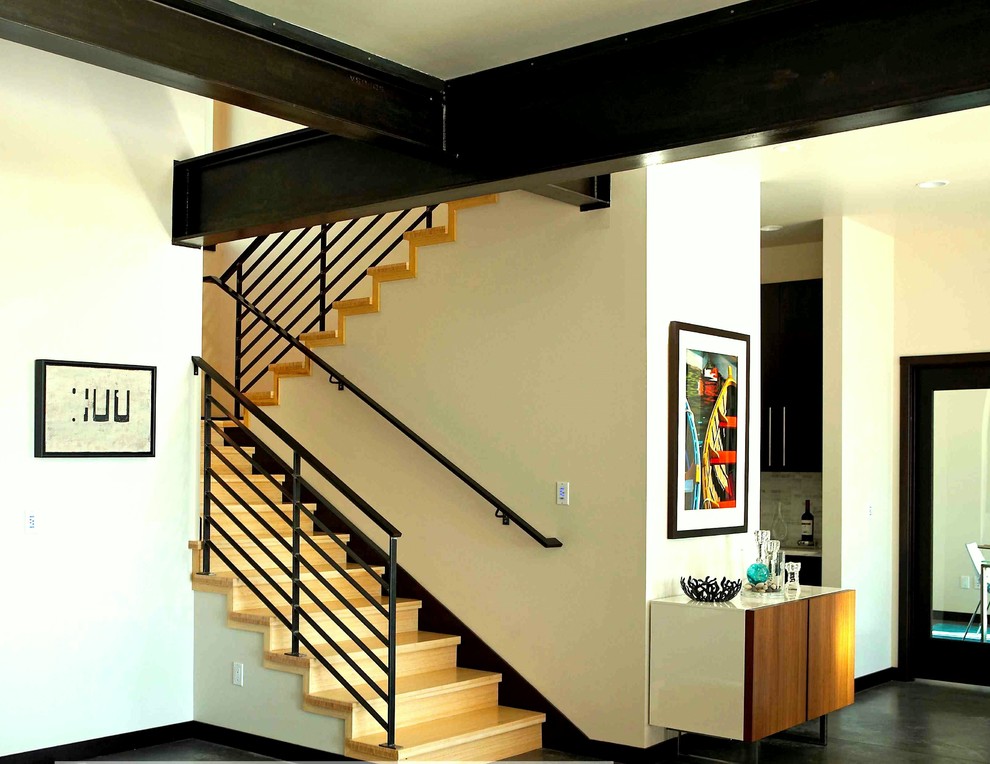 Staircase - mid-sized modern wooden u-shaped metal railing staircase idea in Seattle with wooden risers