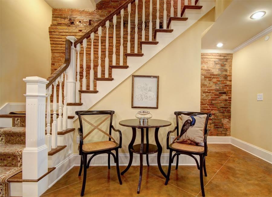 Foto de escalera en L rústica de tamaño medio con escalones de madera y contrahuellas de madera pintada