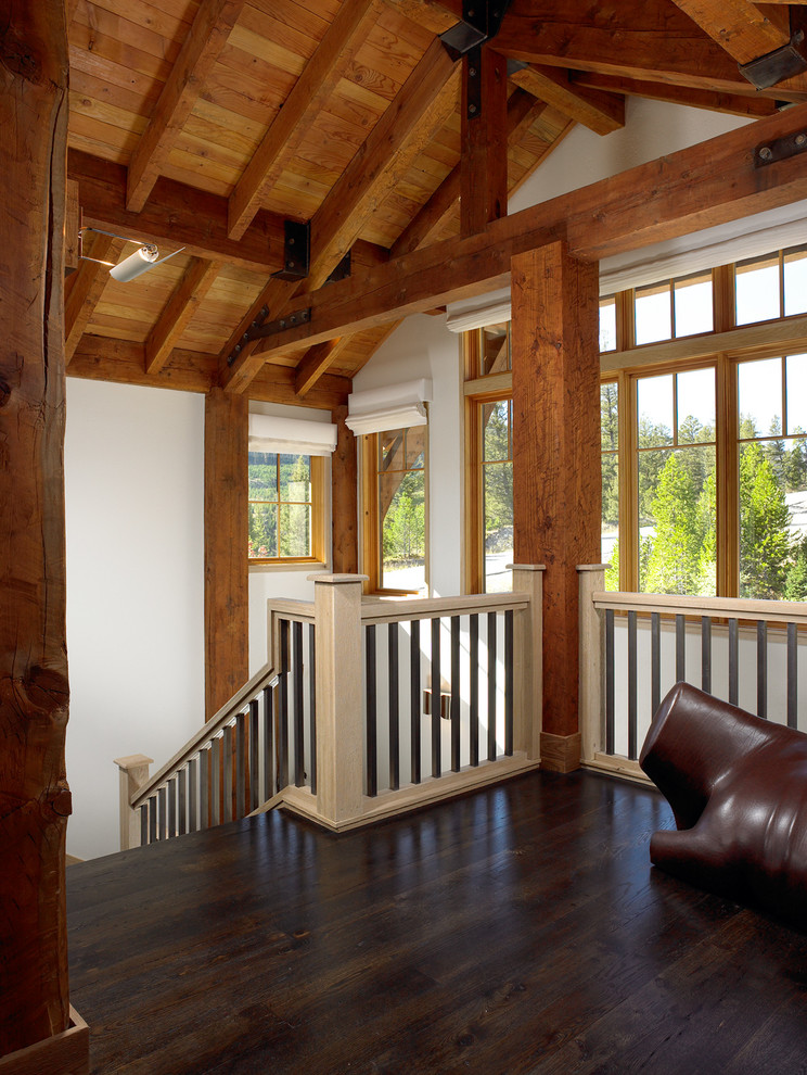 Example of a mid-sized mountain style wooden u-shaped wood railing staircase design in Other with wooden risers