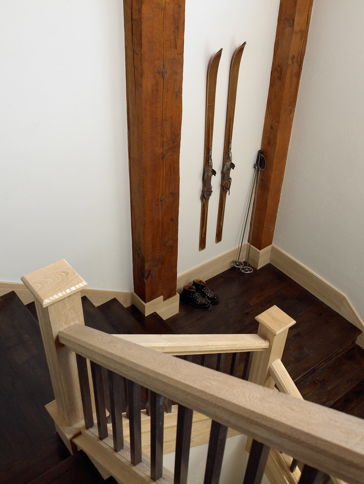 Medium sized rustic wood u-shaped wood railing staircase in Other with wood risers.