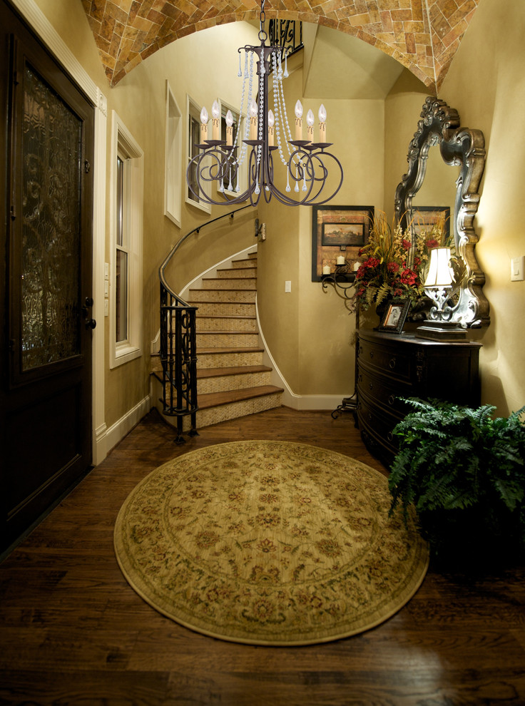 Small elegant wooden curved staircase photo in New York with tile risers