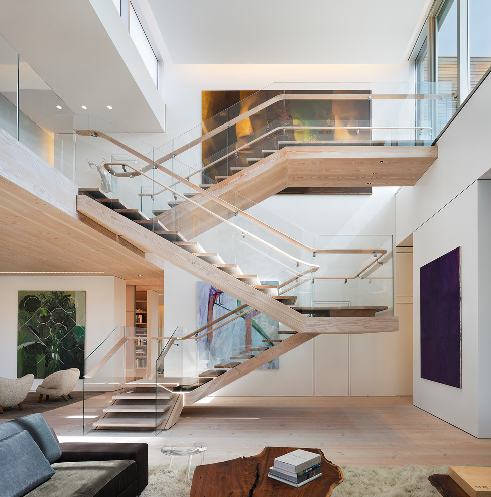 Trendy wooden l-shaped open staircase photo in New York