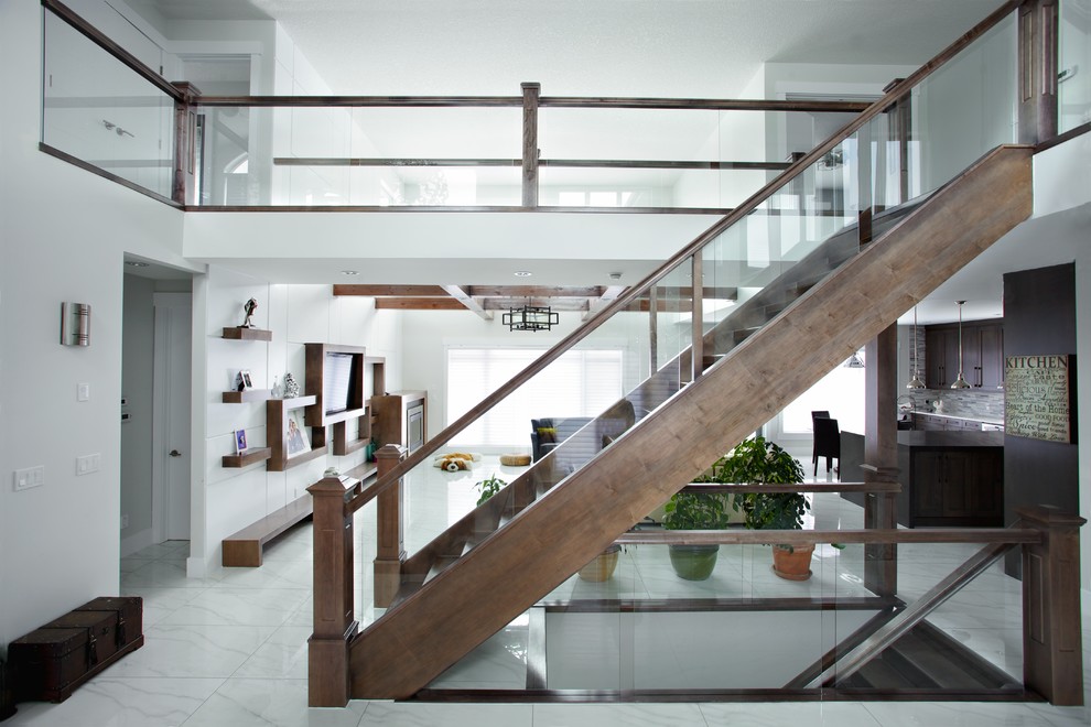 Contemporary wood straight staircase in Edmonton with open risers.