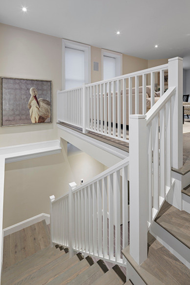 Inspiration for a mid-sized contemporary painted curved staircase remodel in Boston with painted risers