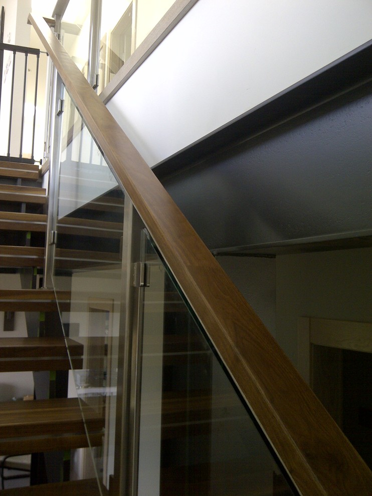 Example of a mid-sized minimalist wooden floating open staircase design in Vancouver