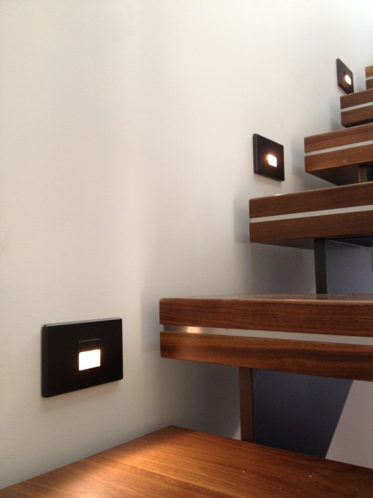 Example of a mid-sized minimalist wooden floating open staircase design in Vancouver