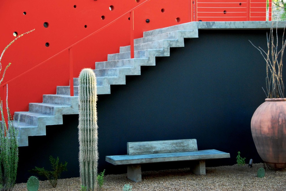Example of a large trendy concrete straight staircase design in Phoenix with concrete risers