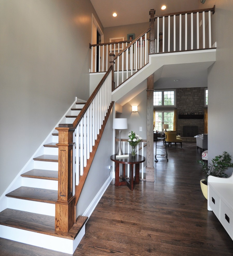 Inspiration for a large transitional wooden l-shaped staircase remodel in Chicago with painted risers