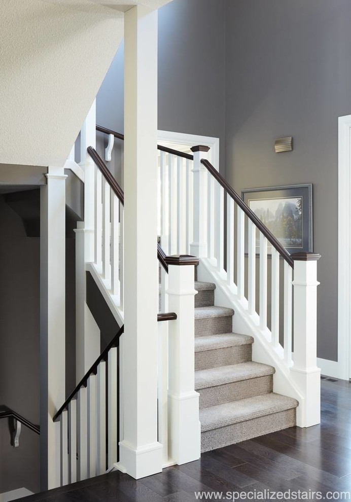 Design ideas for a classic carpeted u-shaped wood railing staircase in Edmonton with carpeted risers.