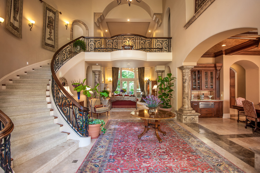 Staircase - mediterranean wooden curved staircase idea in Sacramento with painted risers